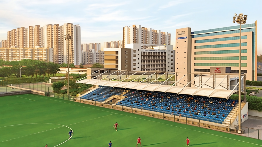 Football Field View with Lodha iThink Tower and Lodha World School in Background